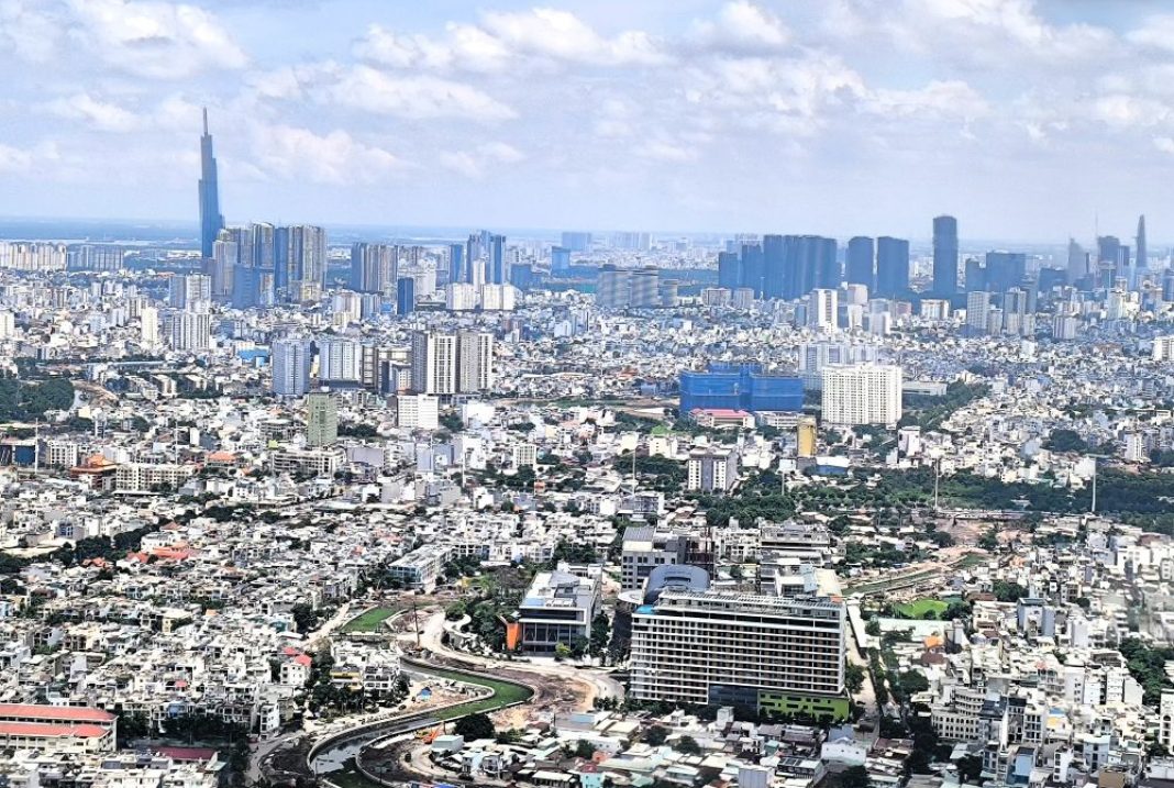 Ho Chi Minh City skyline at dusk with modern high-rise buildings and illuminated streets