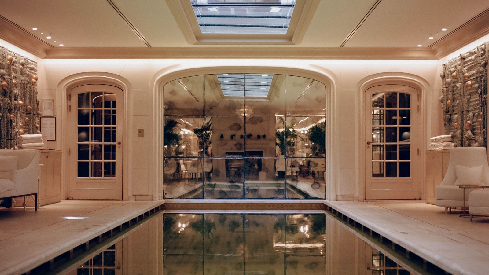 Exterior facade of Hôtel de Crillon at dusk, with lights illuminating its classical architecture