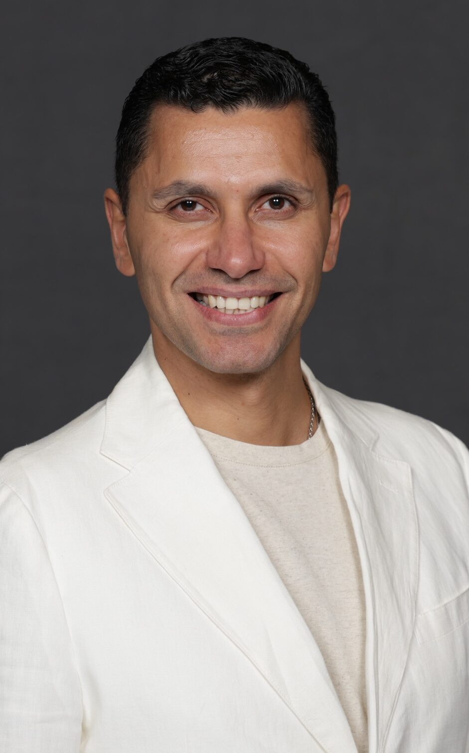 Magdy Abdelaty, one of Rosewood's new Area Directors of Wellness, smiling confidently in a professional headshot