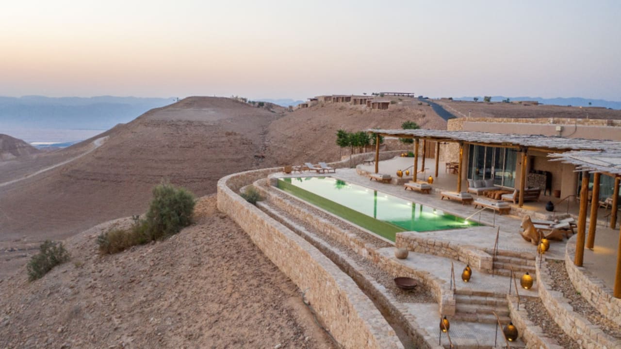 Exterior view of Six Senses Shaharut resort buildings nestled in a desert landscape
