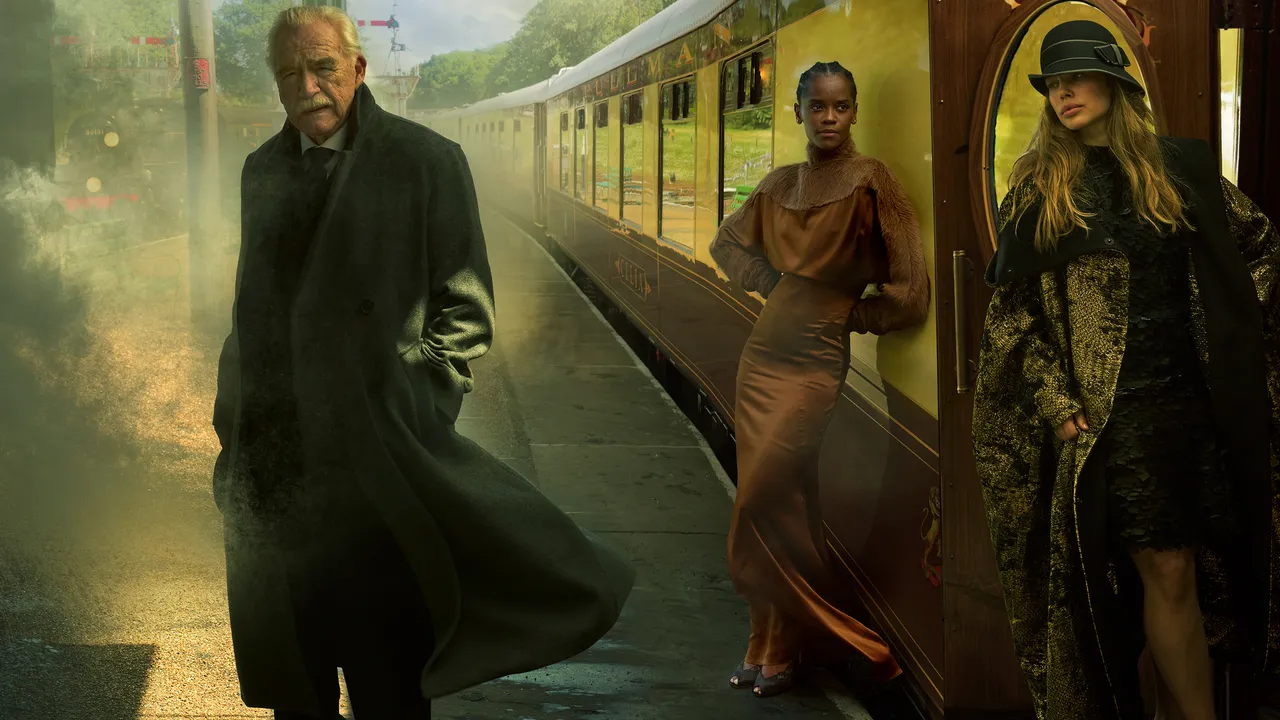 Luke Thompson in a waistcoat on a train with Harriet Walter and Letitia Wright
