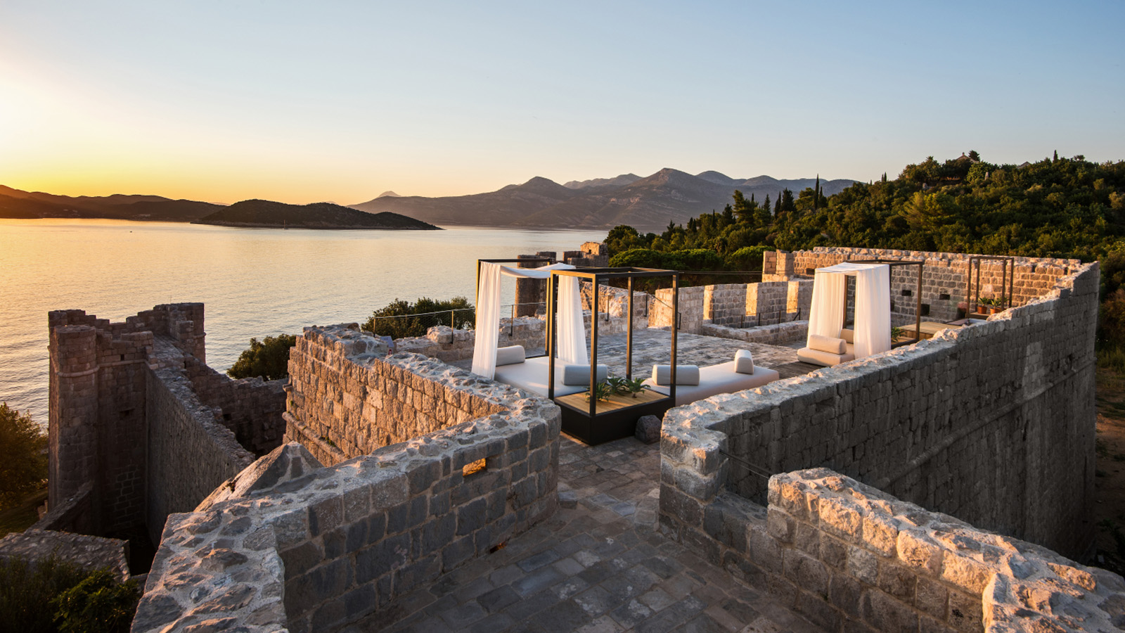 Stone fortress and terraces of LOPUD 1483 overlooking the Adriatic Sea at sunset
