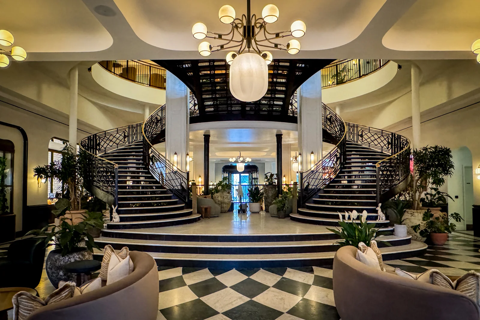 Exterior view of the historic building housing the Six Senses London, featuring distinctive architecture and multiple arched windows.