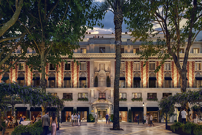 Exterior facade of a historic building in Seville's Plaza Nueva, adorned with traditional Spanish architecture, under a clear sky.