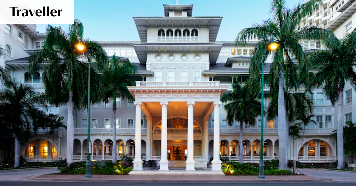 A grand, historic hotel entrance with a porte-cochere and classic architecture.