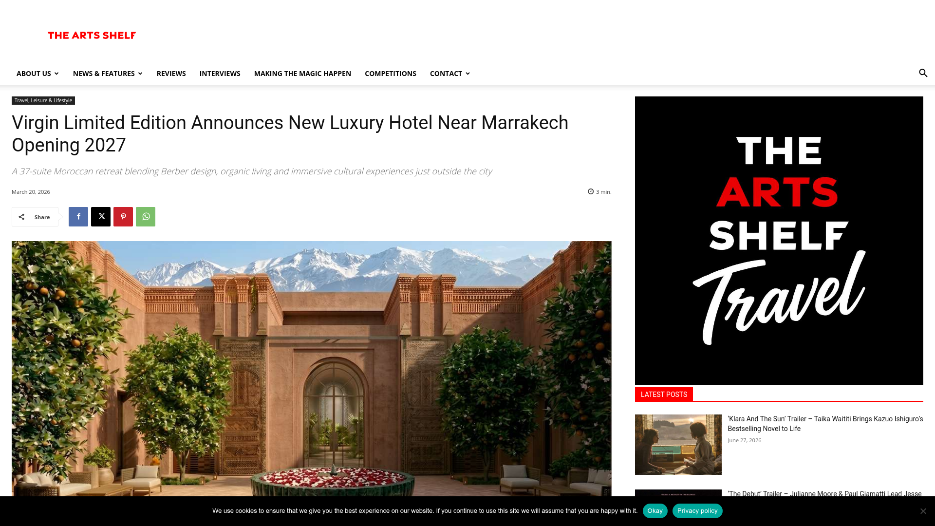 An artist's impression of a luxurious desert resort building with traditional Moroccan architectural elements, surrounded by lush gardens and palm trees under a clear sky.