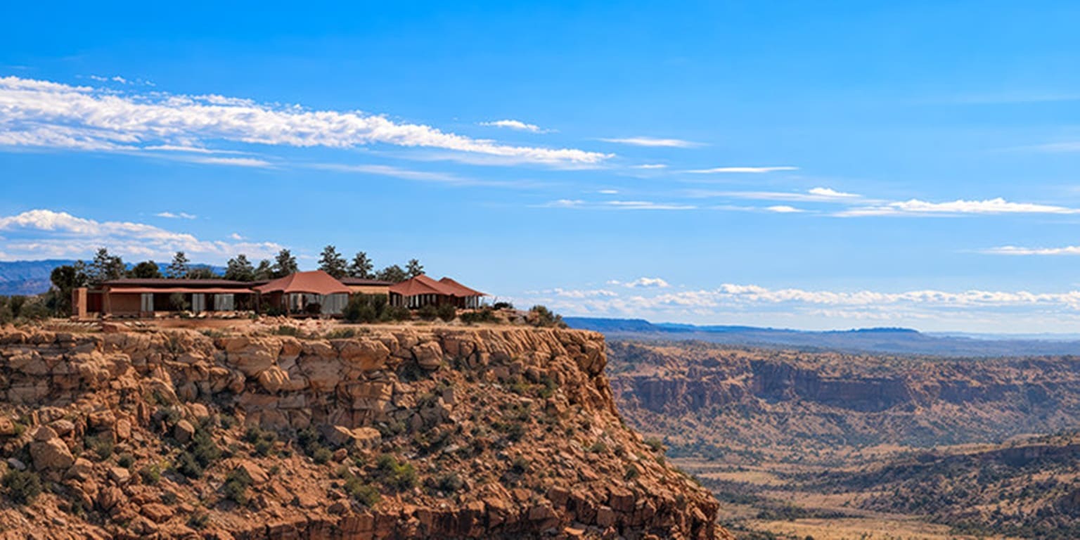 Rendered aerial view of Six Senses Camp Korongo resort nestled in a Utah desert landscape with red rock formations