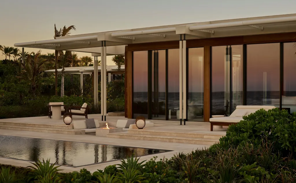 A luxury resort entrance with a gate, possibly a new Aman property