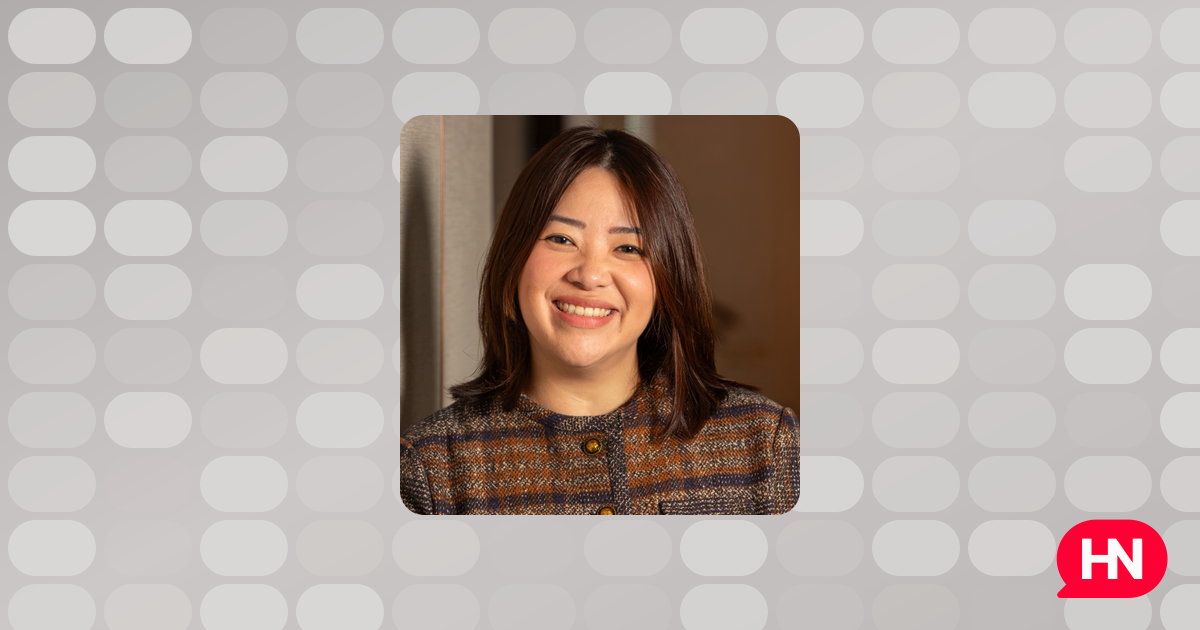 Professional portrait of Marisa Ng, an elegant woman, possibly against a hotel background.