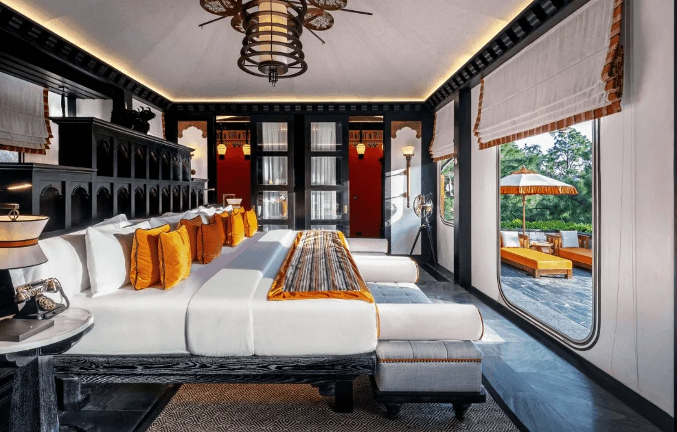 Luxurious tented villa overlooking a river in Bhutan, with traditional Bhutanese architectural elements.