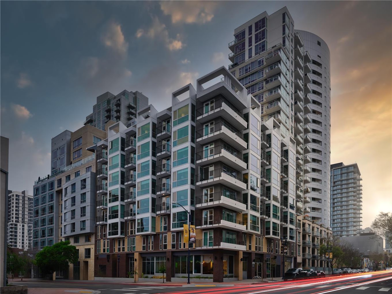 Exterior view of The Margot Hotel, a modern building with large windows, in an urban setting.